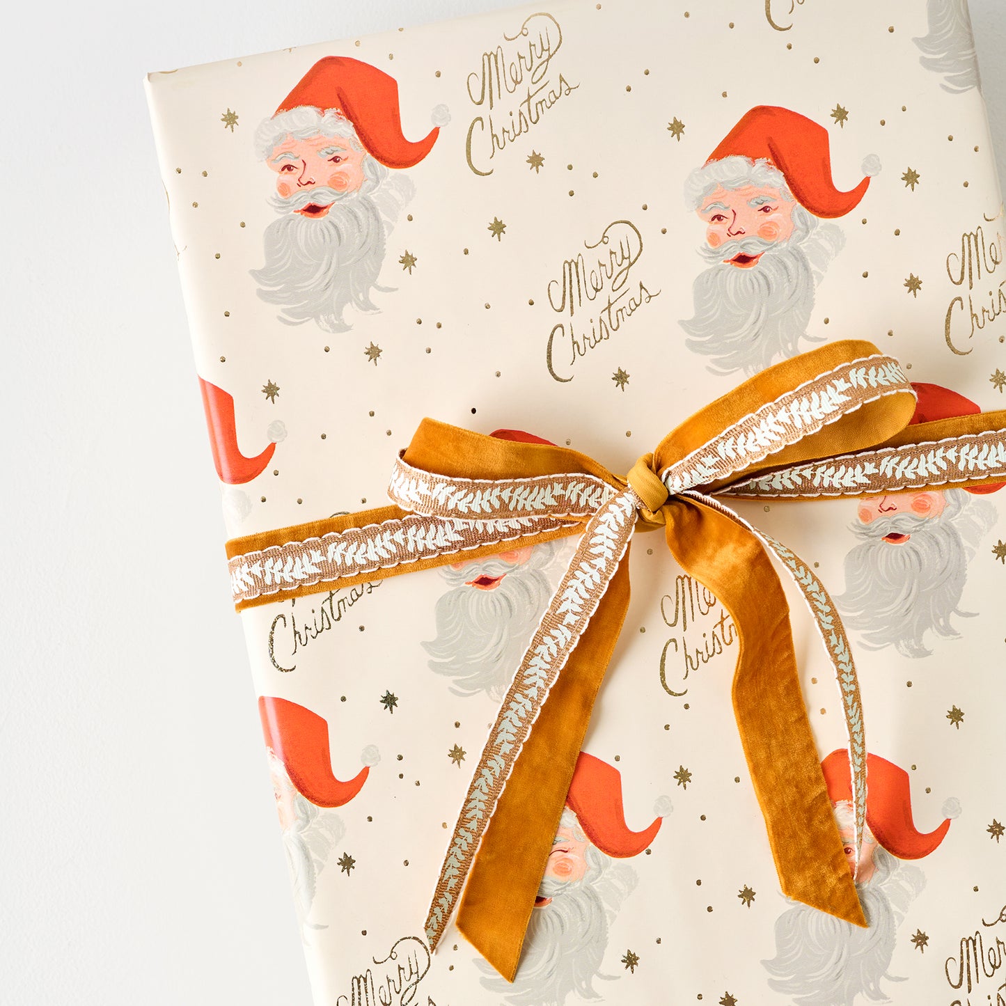 Santa Wrapping Paper Roll shown on gift