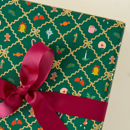 Holiday Argyle Continuous Wrapping Roll shown on gift with red ribbon