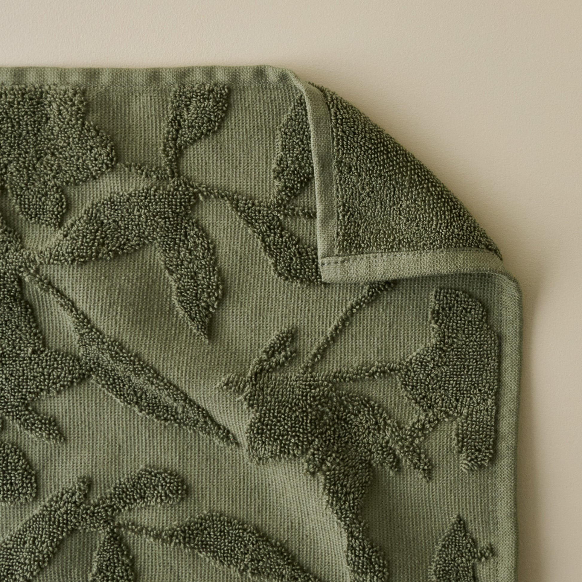 Winter Moss Floral Jacquard Towel corner shown folded