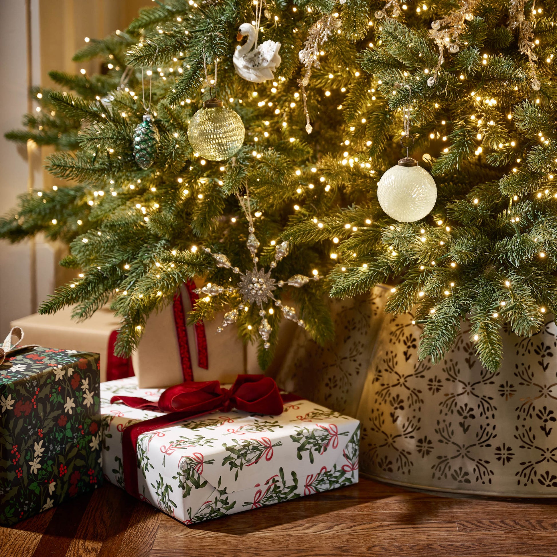 Mistletoe Classic Wrapping Paper Sheets under a tree