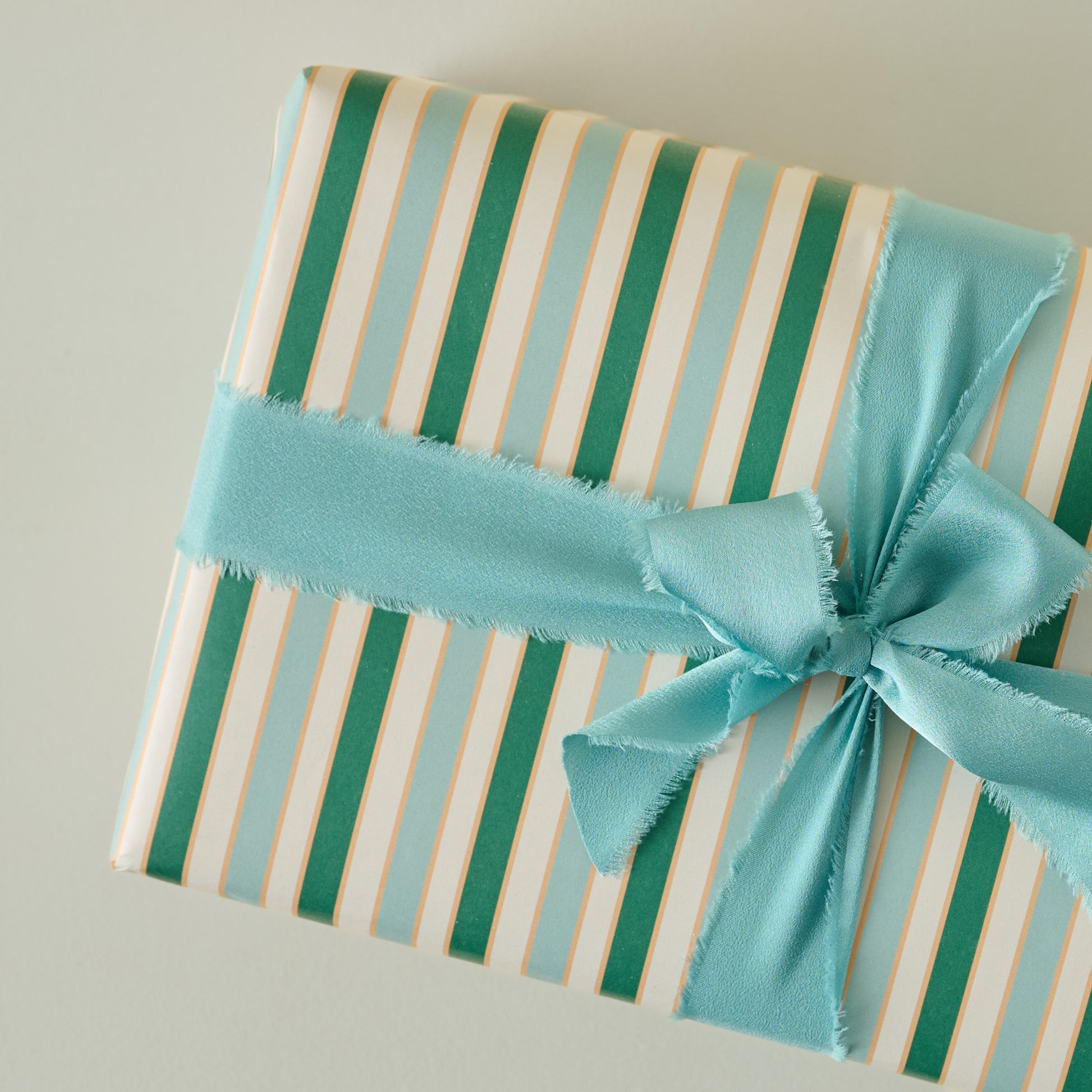 Everyday Stripes 3 Sheet Wrapping Roll shown on gift with ribbon