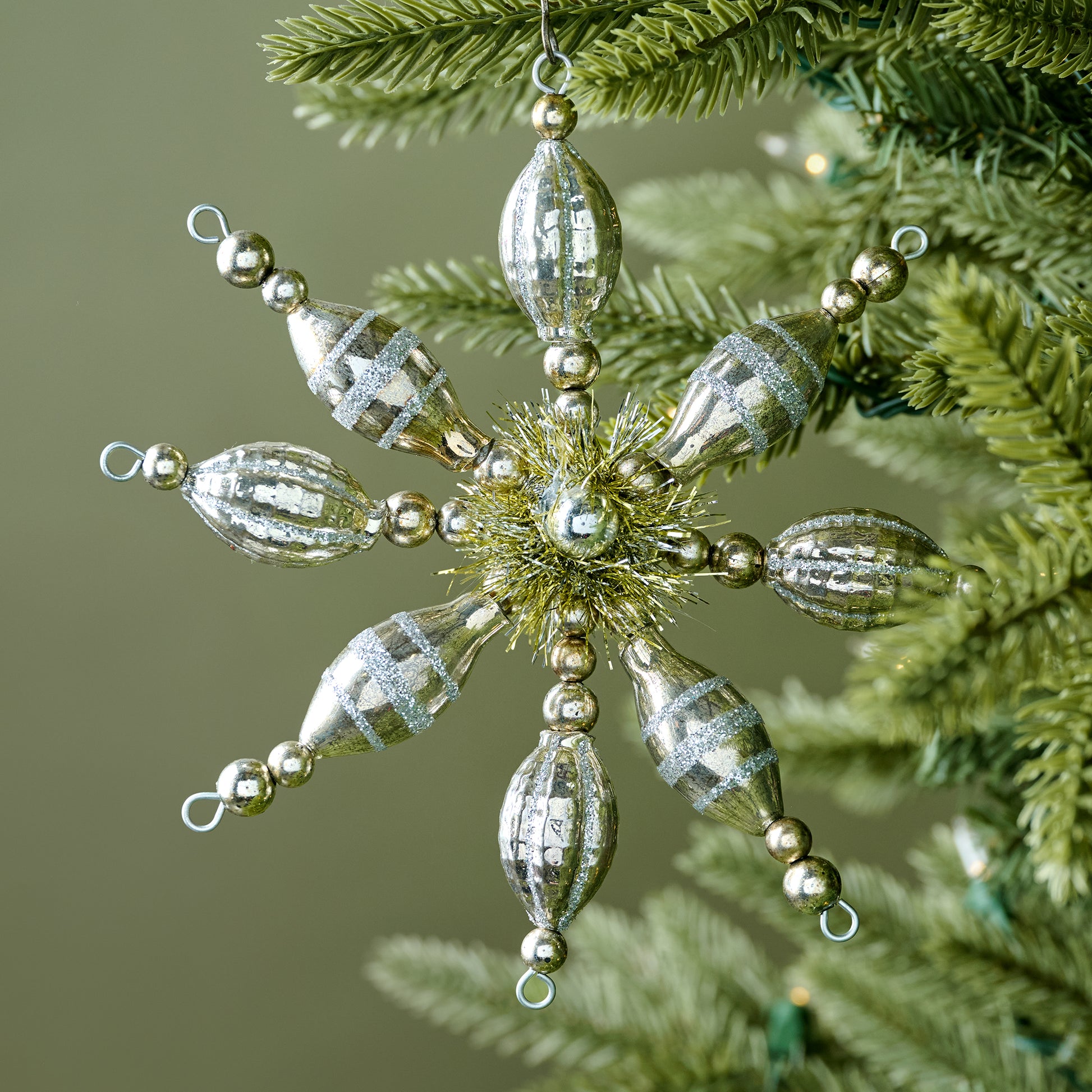Vintage-Inspired Snowflake Ornament shown on tree
