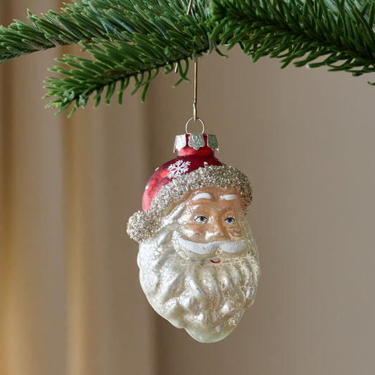 Vintage Blown Glass Santa Ornament shown on tree
