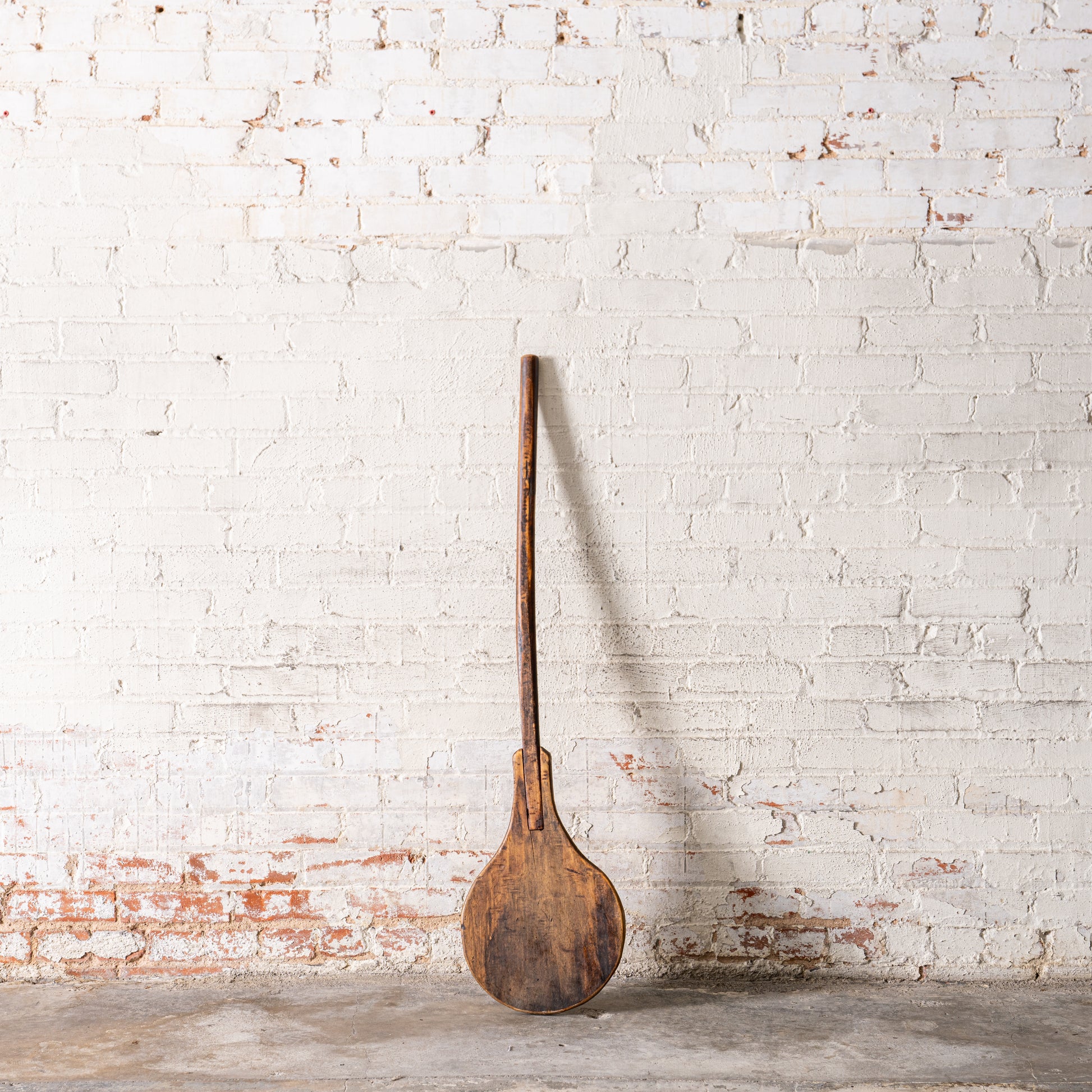 Vintage European Bakery Paddle against wall
