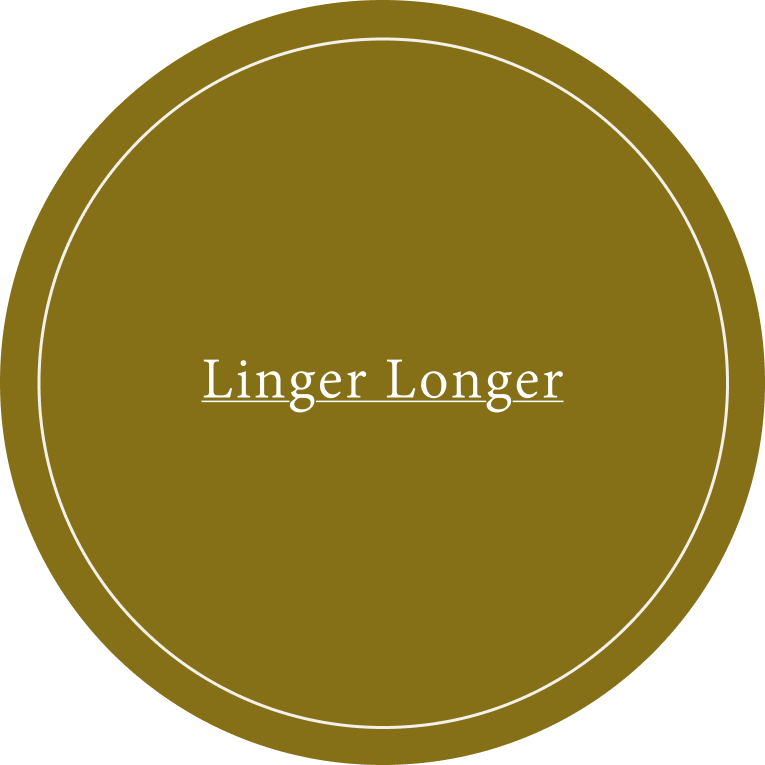 A circular color swatch in a warm olive-brown shade, featuring the text 'Linger Longer' in white at the center.
