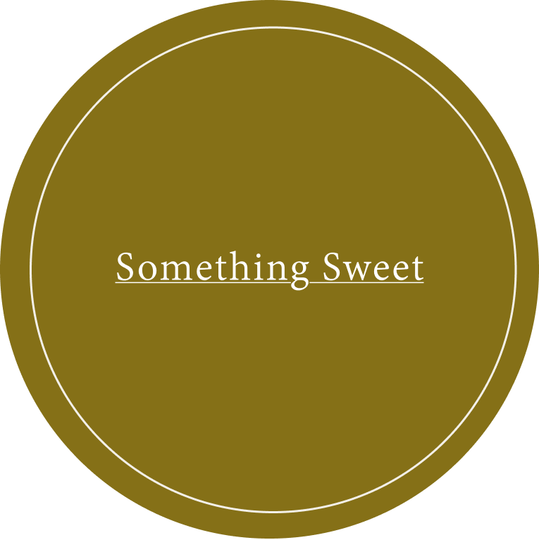 A circular graphic with a solid olive-brown background, a thin white inner circle, and the words 'Something Sweet' centered in white serif text.
