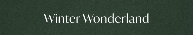 The text 'Winter Wonderland' in white serif lettering centered on a dark green textured background.