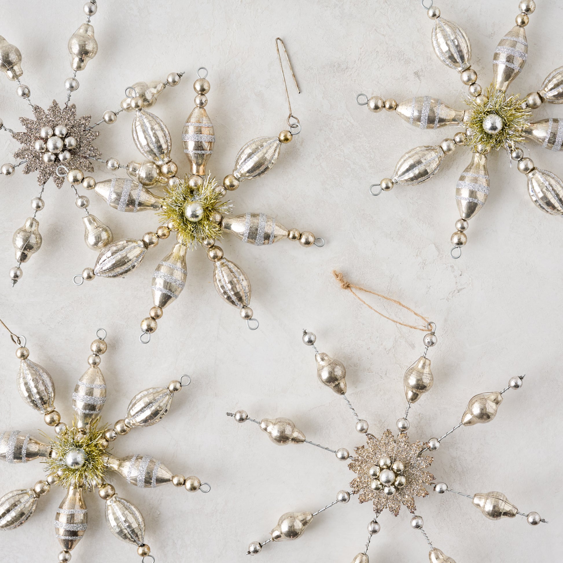 Mercury Glass Beaded Snowflake Ornament shown with other ornaments