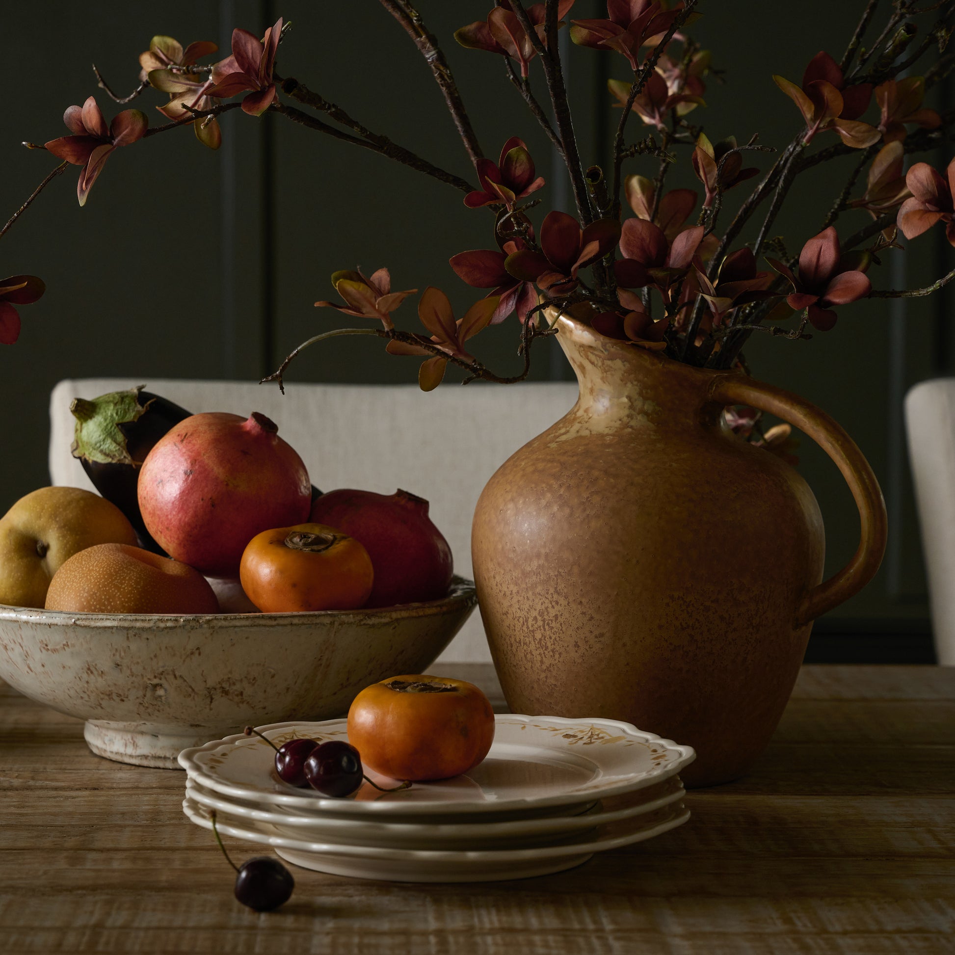 Rustic Cream Accent Bowl containing fruit on a table