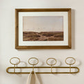 Coastal Reverie shown hung above wall hooks