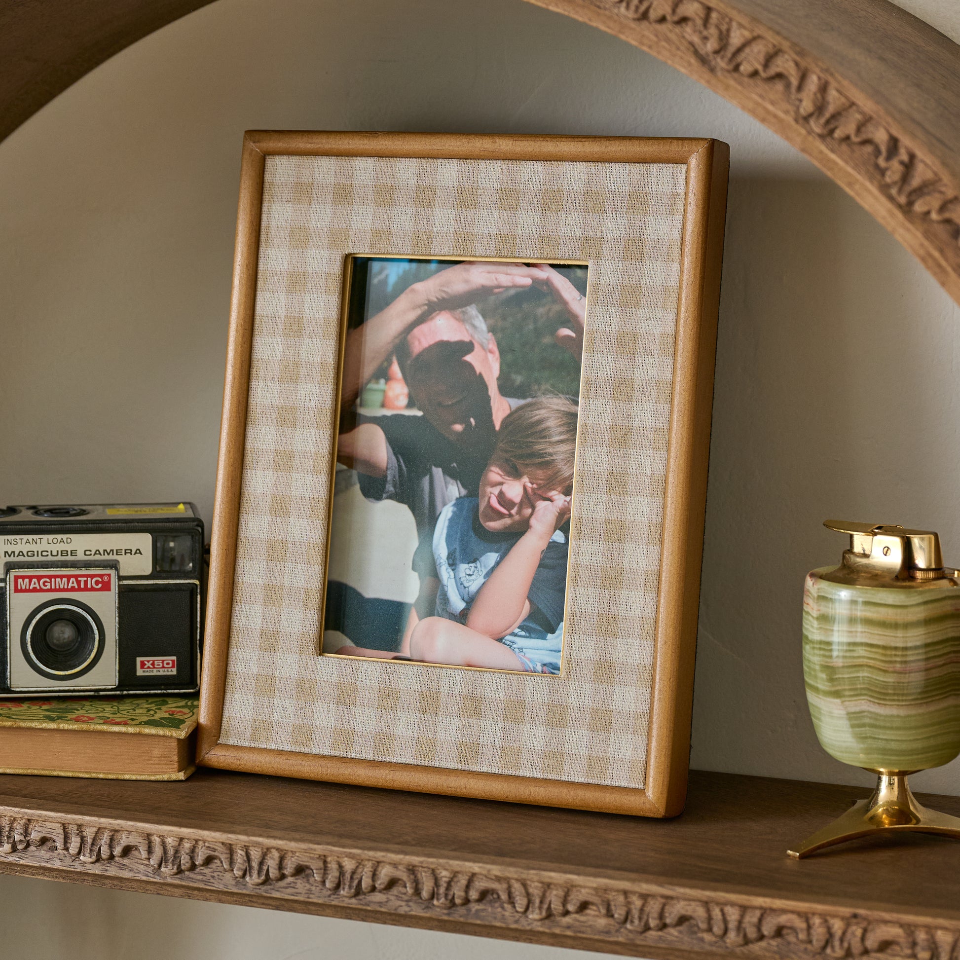 Maren Gingham Photo Frame shown styled on shelf with image