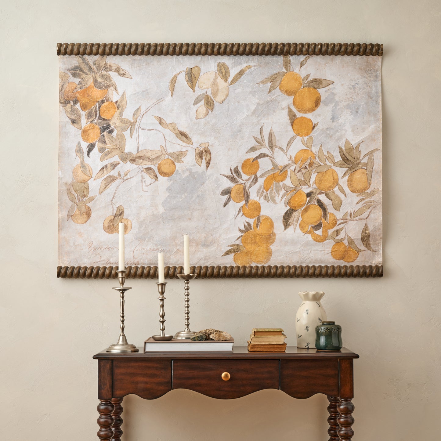 Vintage Arancia Tapestry styled in a room with taper holders and decorative accents