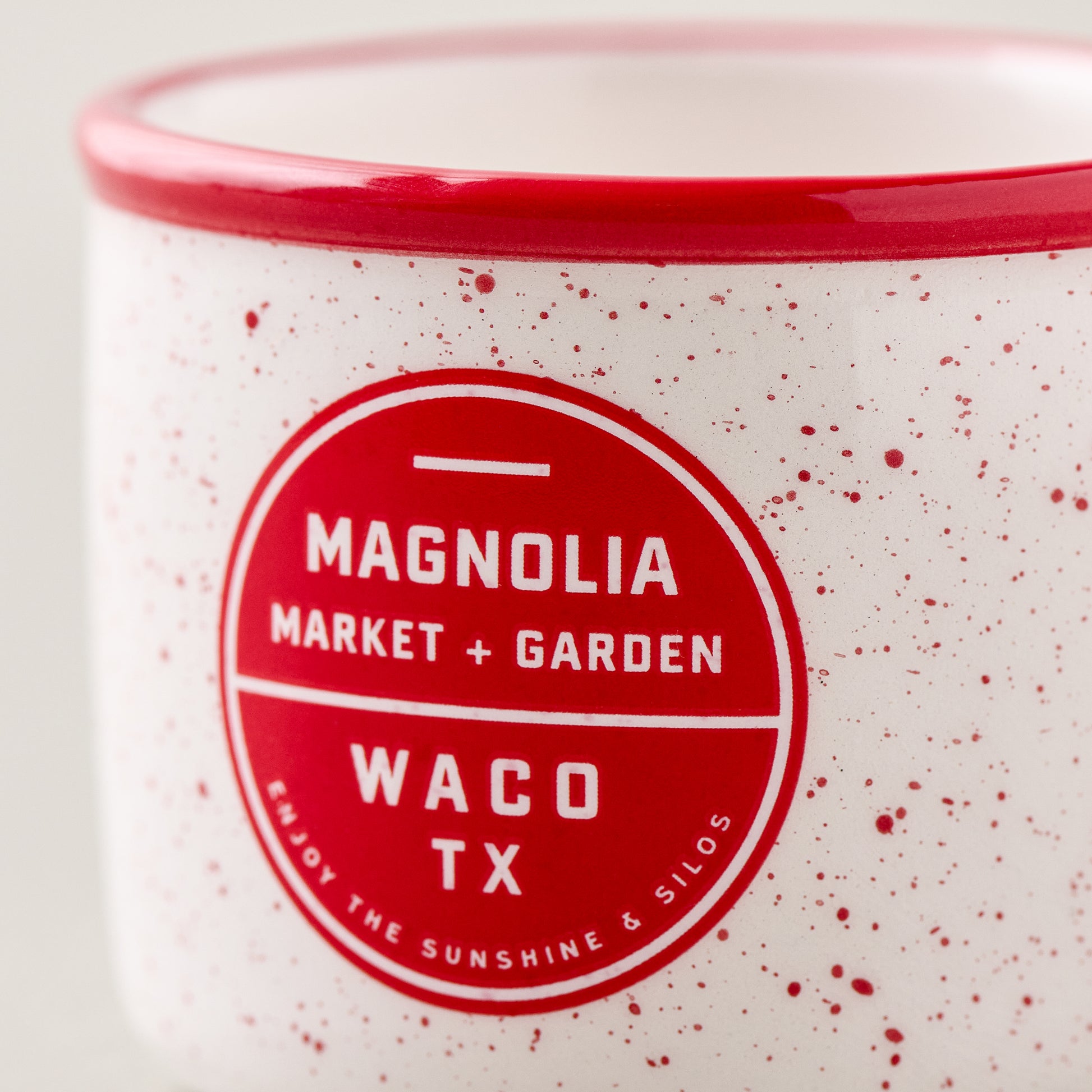 Red Magnolia Campfire Mug Ornament close up of logo on mug