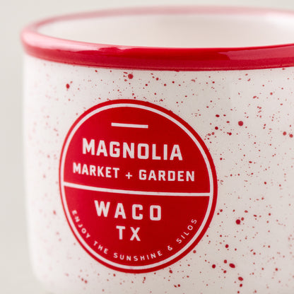 Red Magnolia Campfire Mug Ornament close up of logo on mug