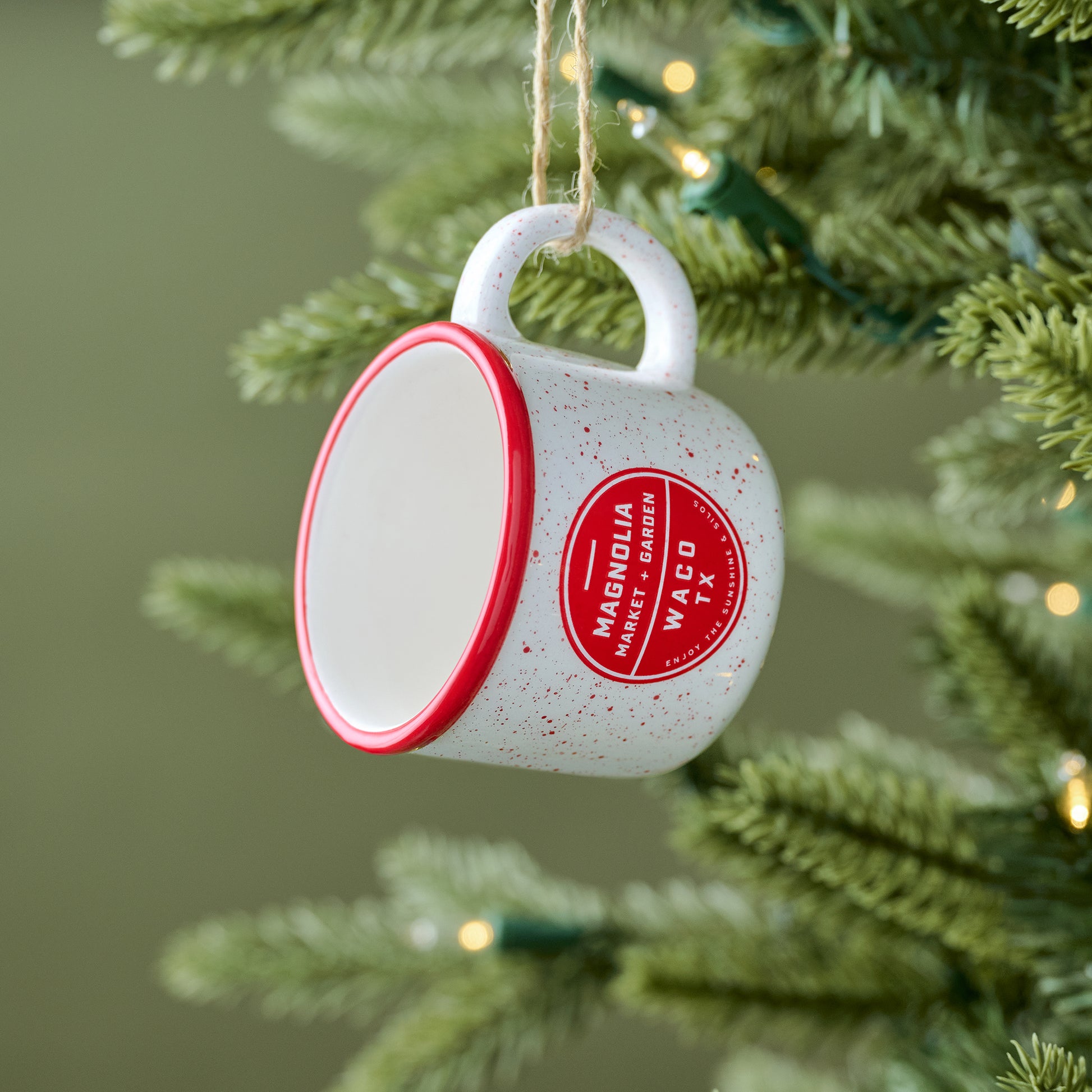 Red Magnolia Campfire Mug Ornament shown on tree