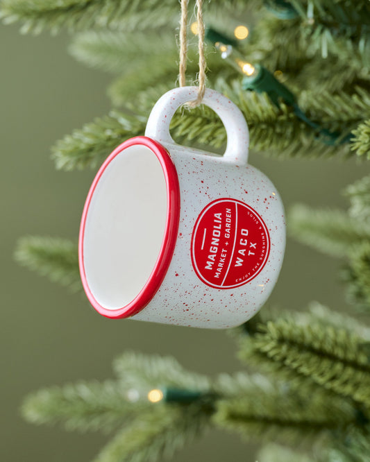 Red Magnolia Campfire Mug Ornament shown on tree