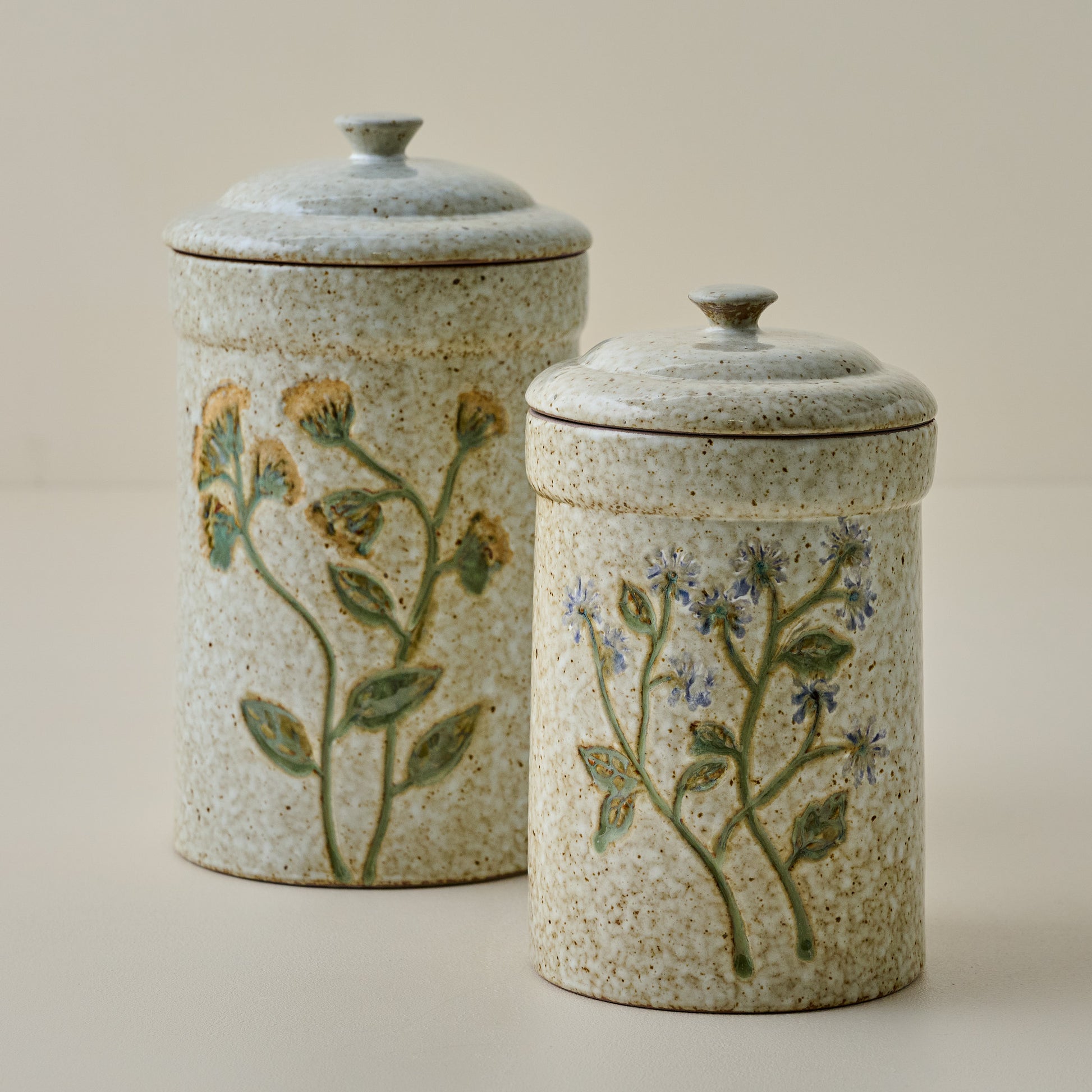 Blue Wildflower Canister shown with canister with yellow wildflowers
