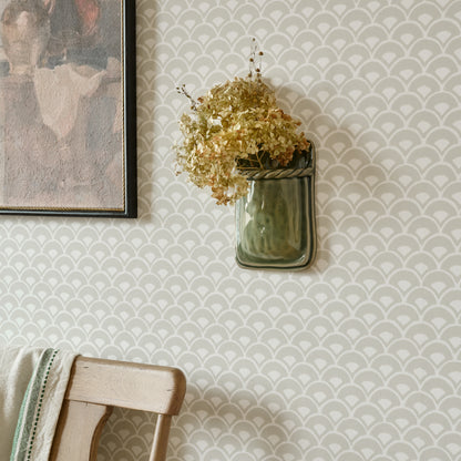 Green Hale Ceramic Wall Vase shown styled on wall