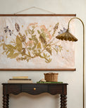 Jo's Hand Pressed Herbarium Tapestry - Seasonal Symphony on a wall above console table
