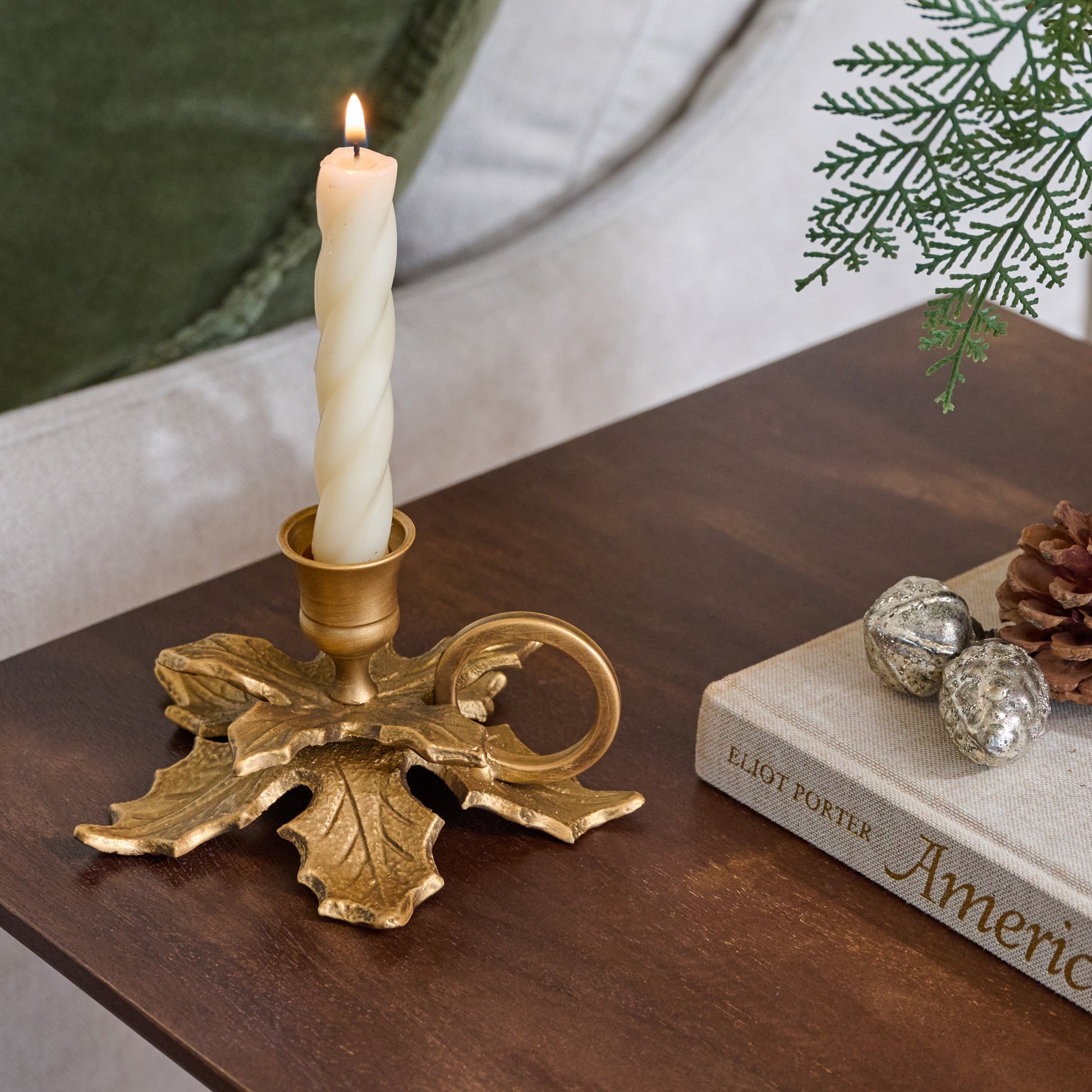 Brass Holly Candle Holder with Handle shown with candle