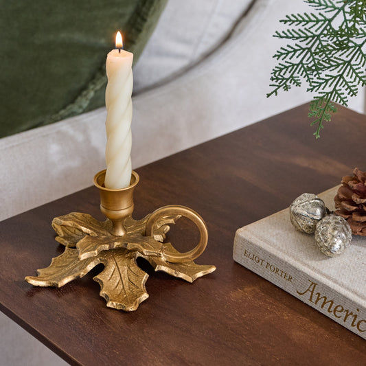 Brass Holly Candle Holder with Handle shown with candle