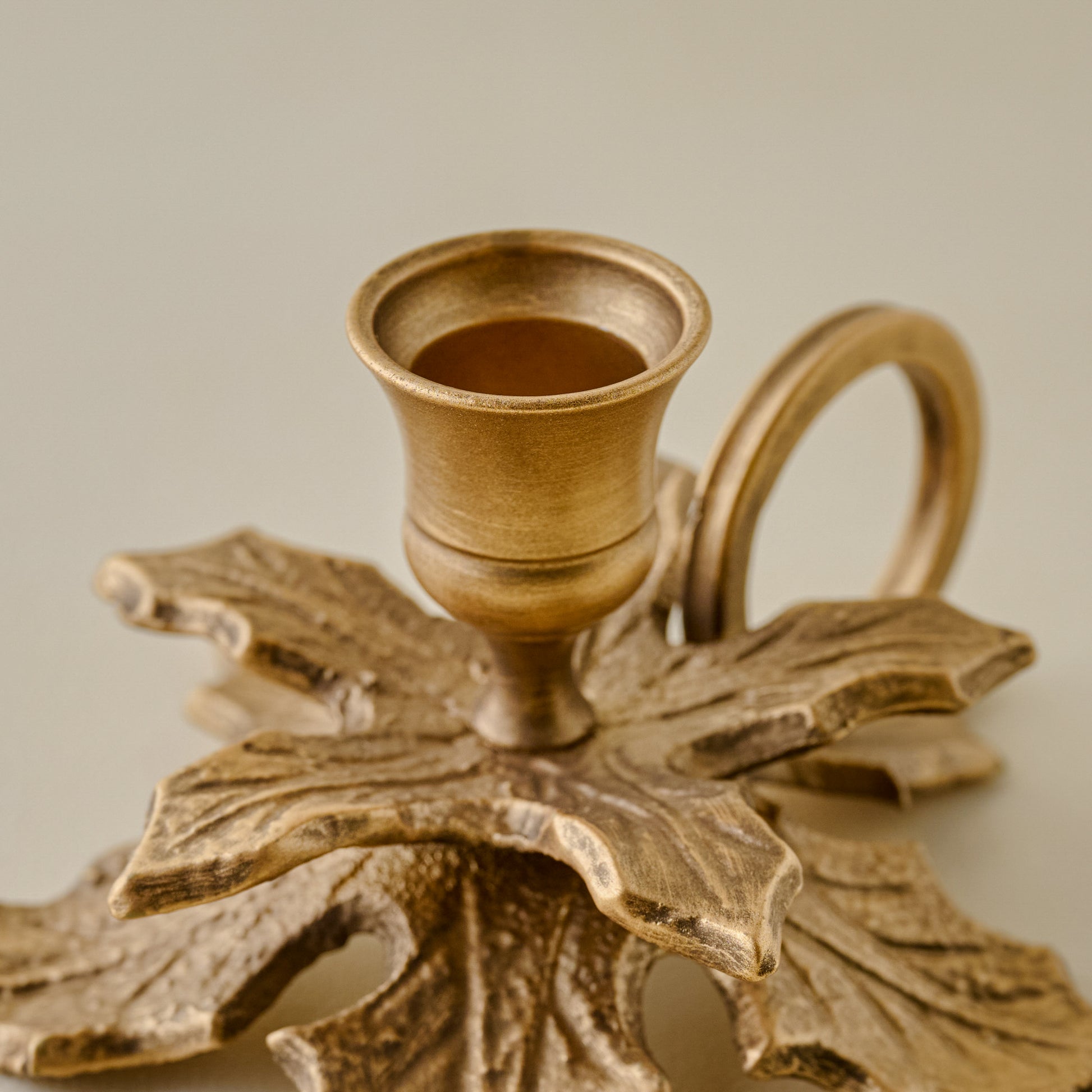 Brass Holly Candle Holder with Handle up close