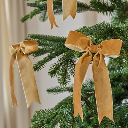 Amber Velvet Bow Ornament Clip, Set of 8 shown on tree