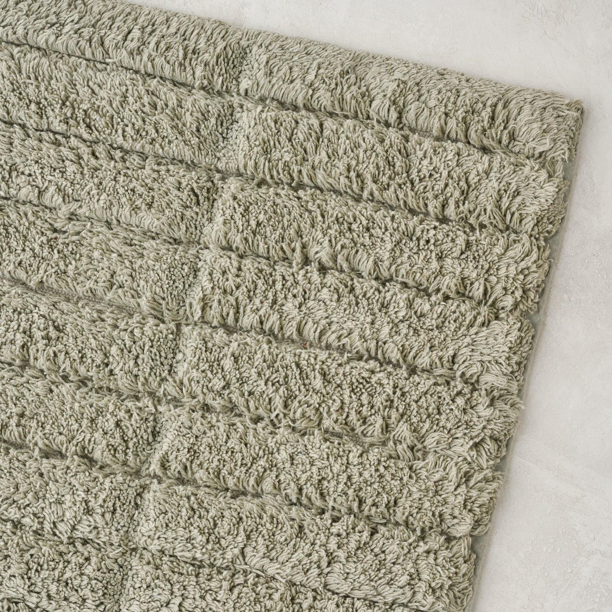 close up view of Eucalyptus Green Textured Bath Mat