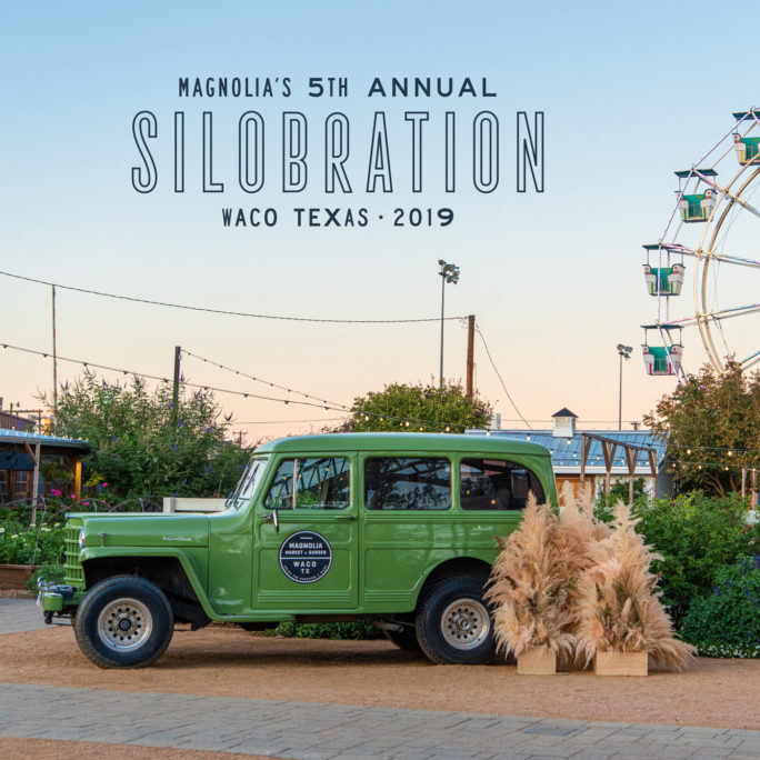 Green truck and straw bale in front of a Ferris wheel with 'Silobration' text in Waco, Texas.