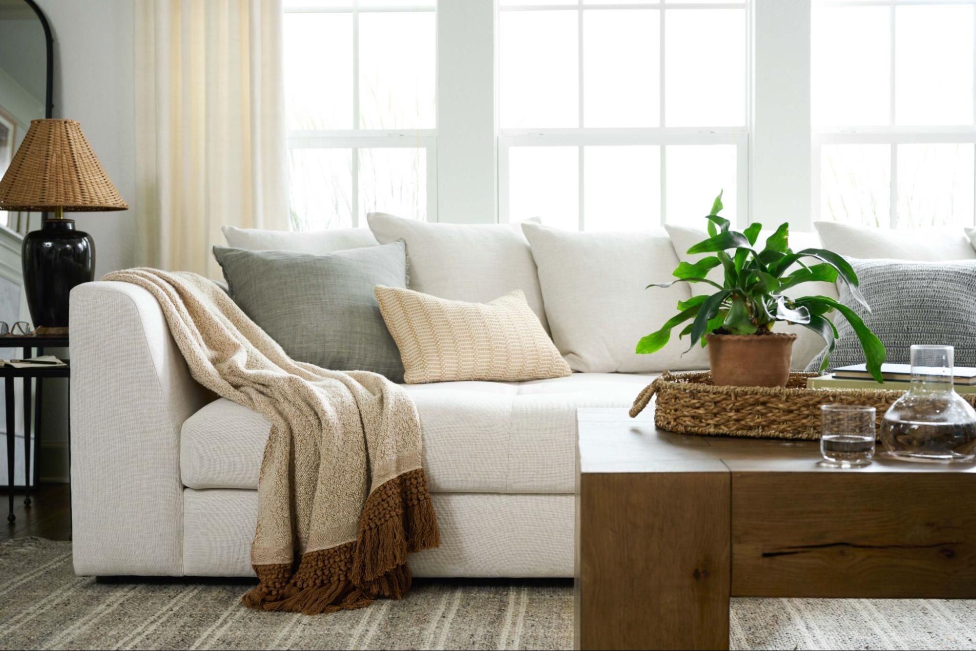 Sofa sits inside a Magnolia room scene.