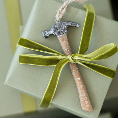 #DEMODAY Hammer Ornament shown attached to gift