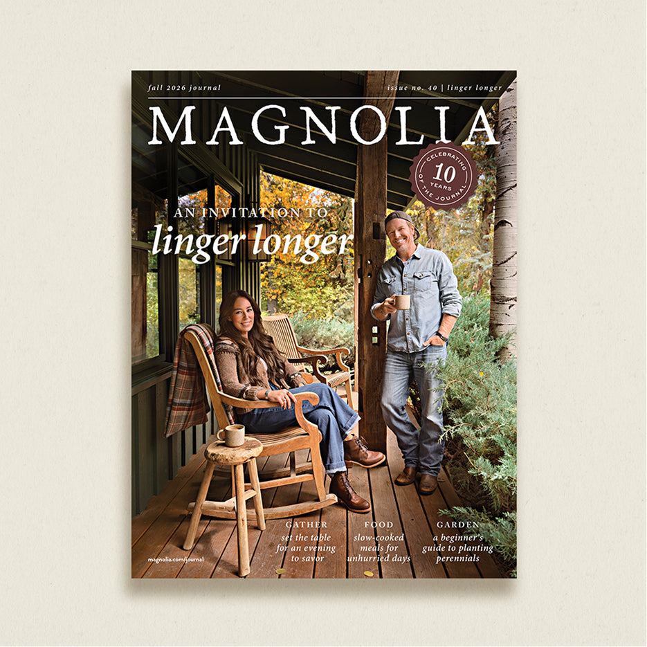A magazine cover for Magnolia, Fall 2024 Journal, featuring a man and woman on a rustic wooden porch. The title 'MAGNOLIA' is prominently displayed at the top, with cover lines and a circular '10 Years' badge.