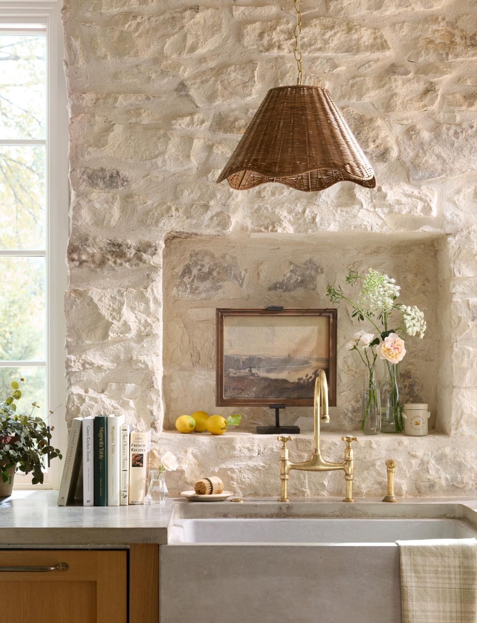 Kitchen with stone wall, sink, and decorative elements