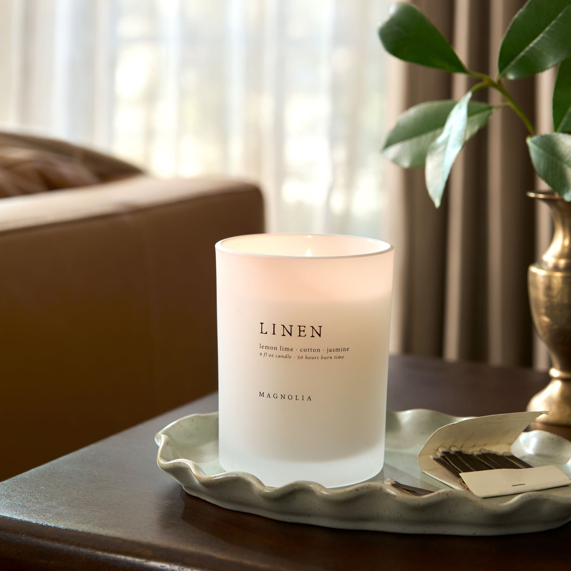 magnolia linen candle set on scalloped green tray