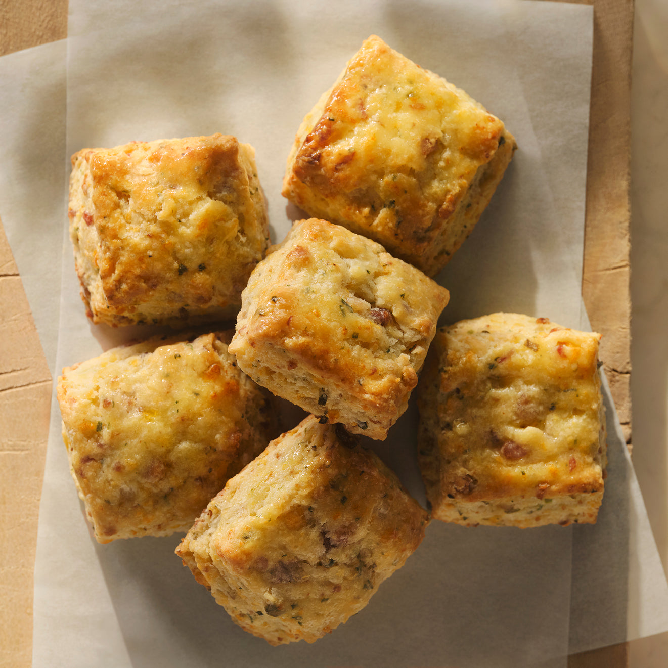 Square biscuits on a piece of parchment paper