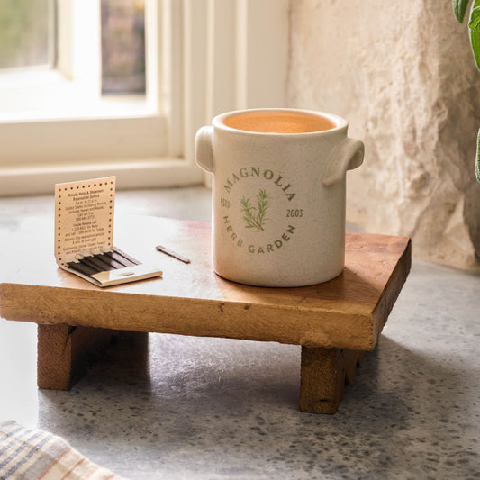 Magnolia Herb Garden Candle set on wooden riser