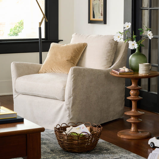Sabine Slipcover Swivel Chair in shell in a room