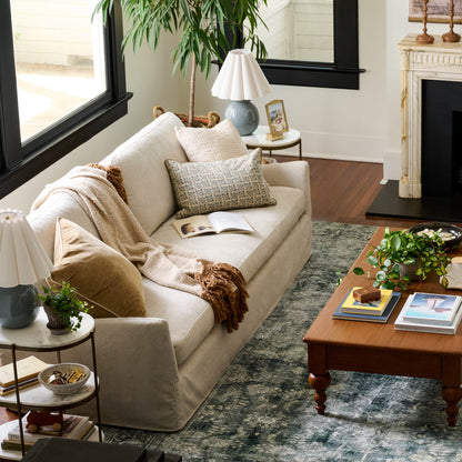 Sabine Slipcover Sofa in shell in a room