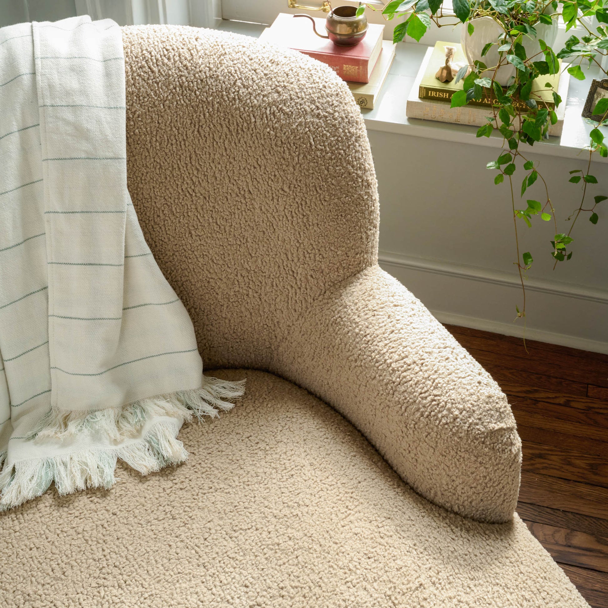 Ruby swivel chair with florence plaid throw