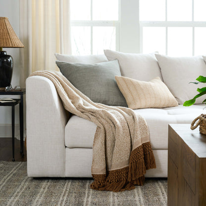 Adobe tassel throw on white sectional couch