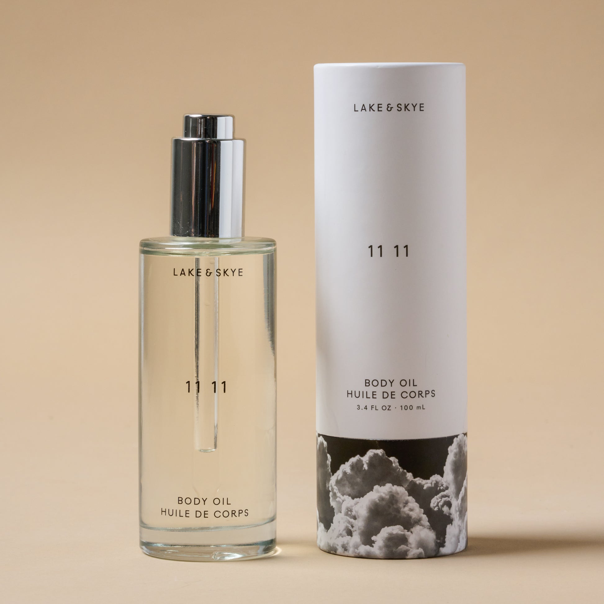 Lake & Skye 11 11 Body Oil next to a larger bottle size of lake & skye body oil