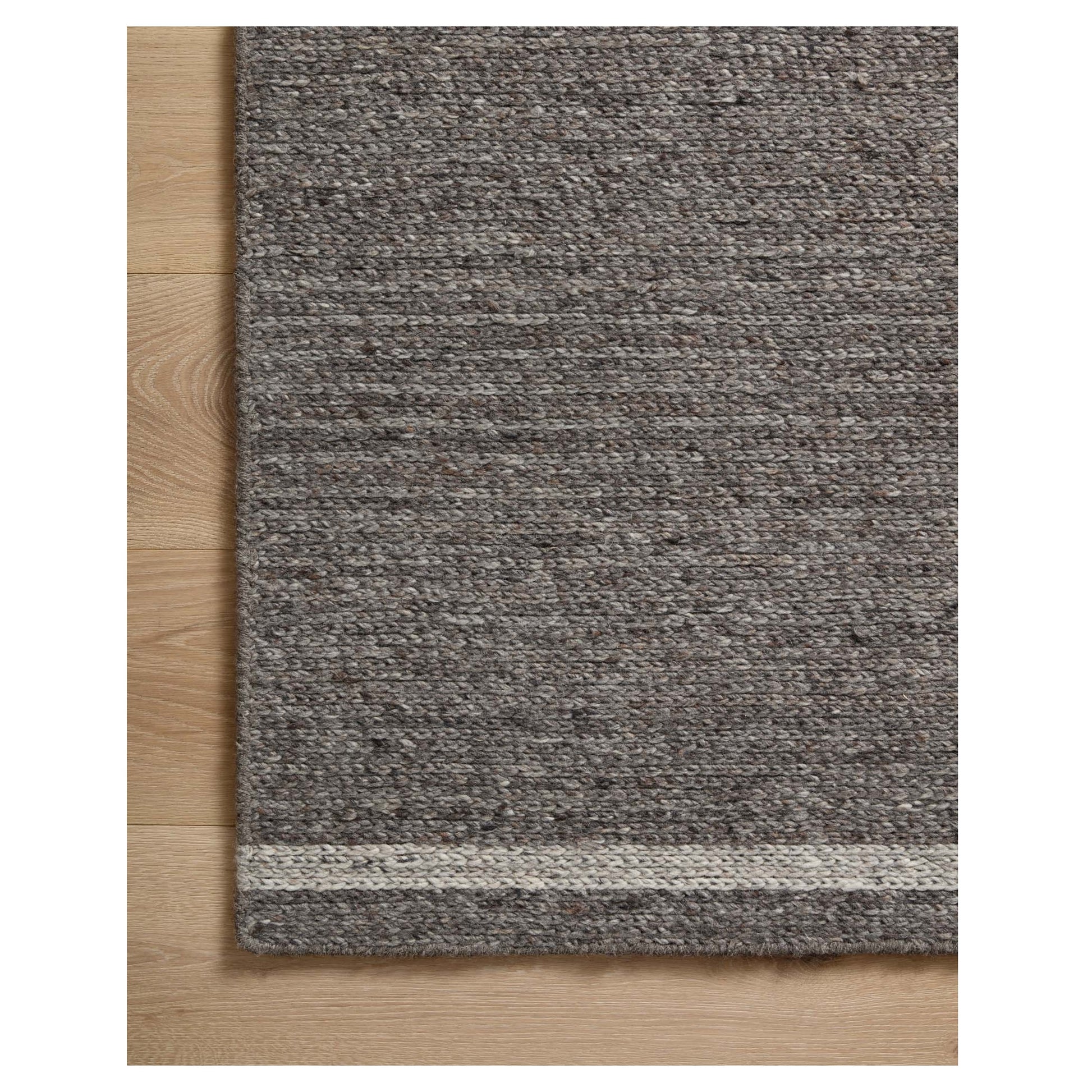 Ashby Granite Silver Rug corner of rug on wood floor