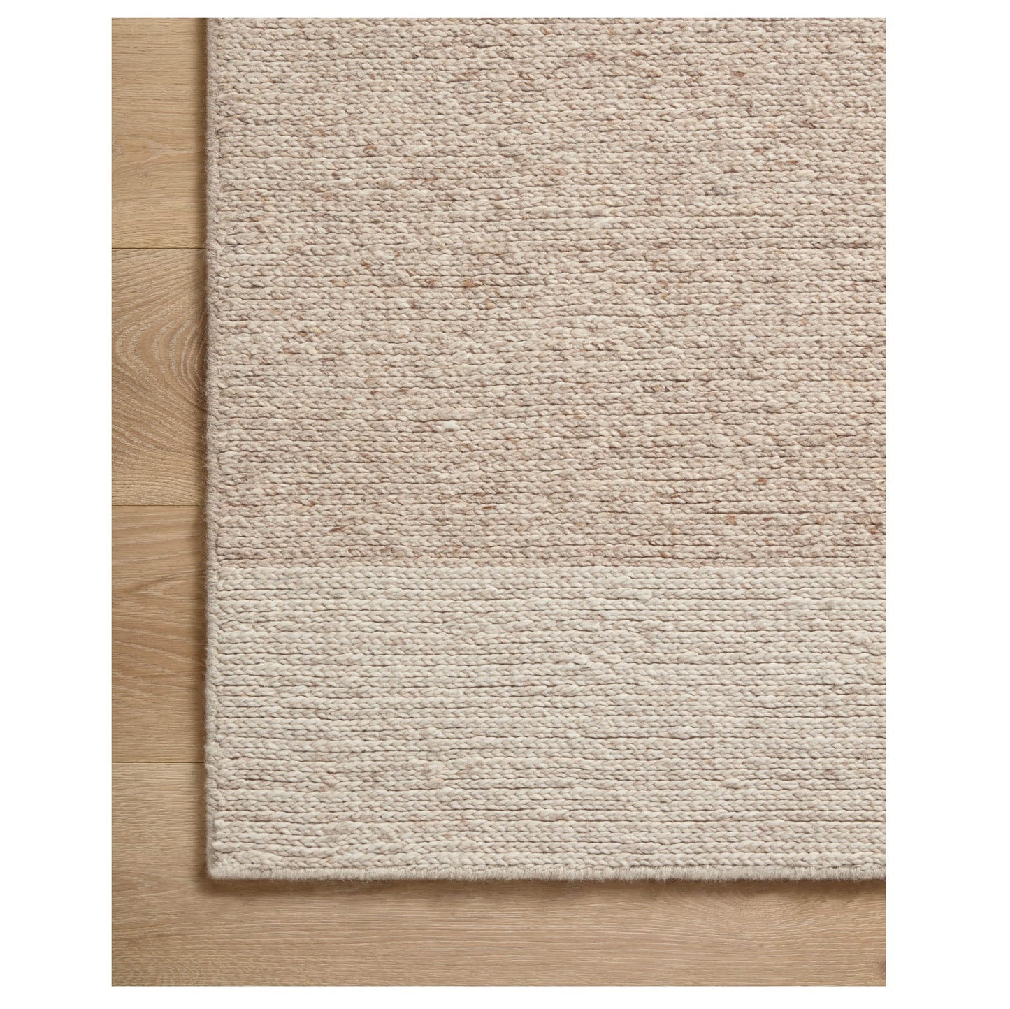 Ashby Oatmeal Natural Rug corner on wood floor