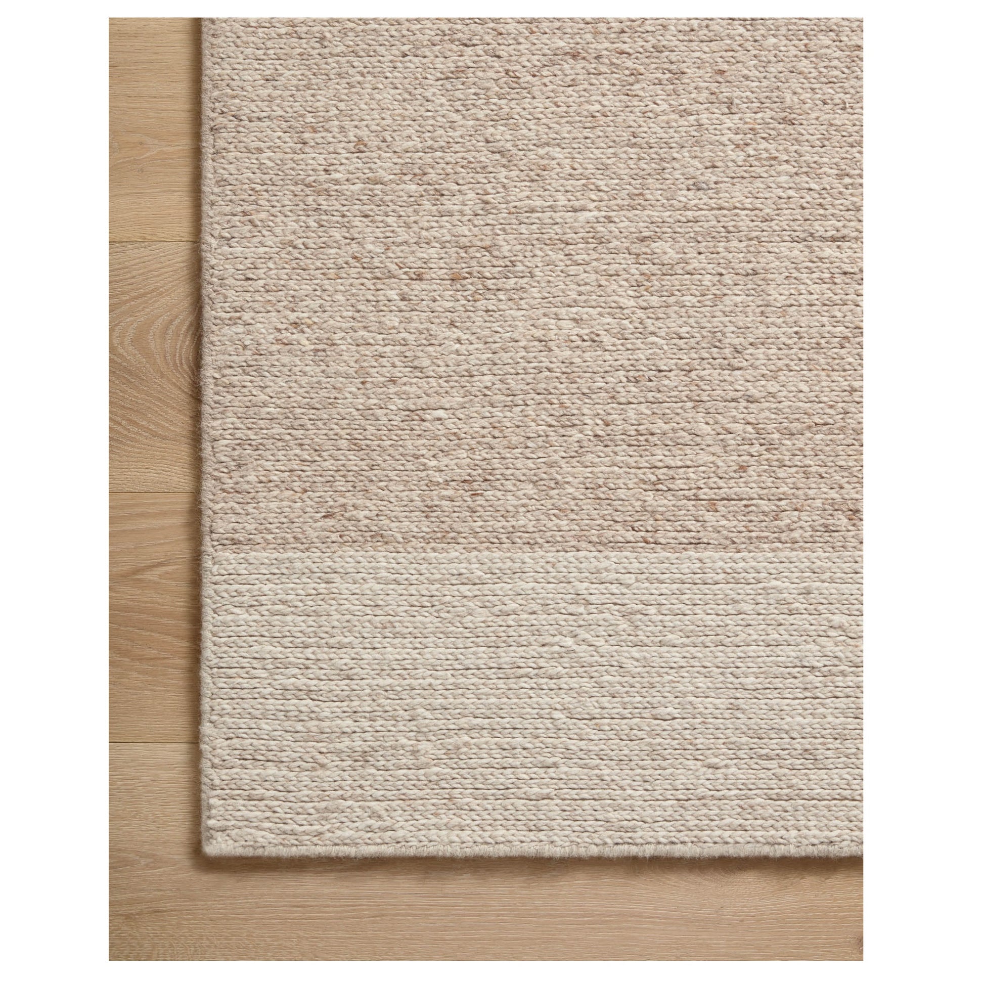 Ashby Oatmeal Natural Rug corner on wood floor
