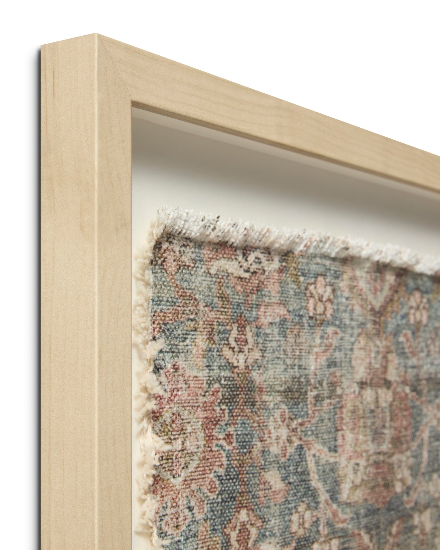 corner view of Marbella Framed Textile shows wood frame and frayed textile edge