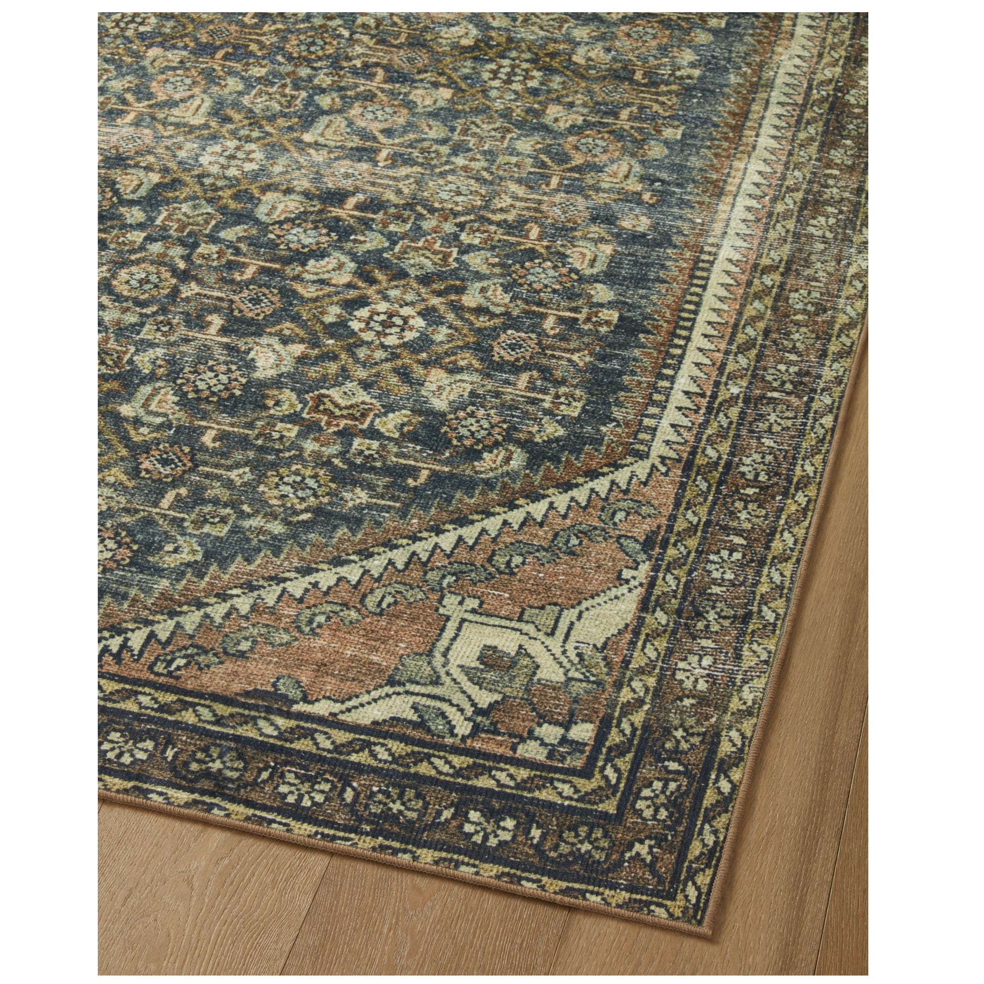 Banks Denim Clay Rug corner on wood floor