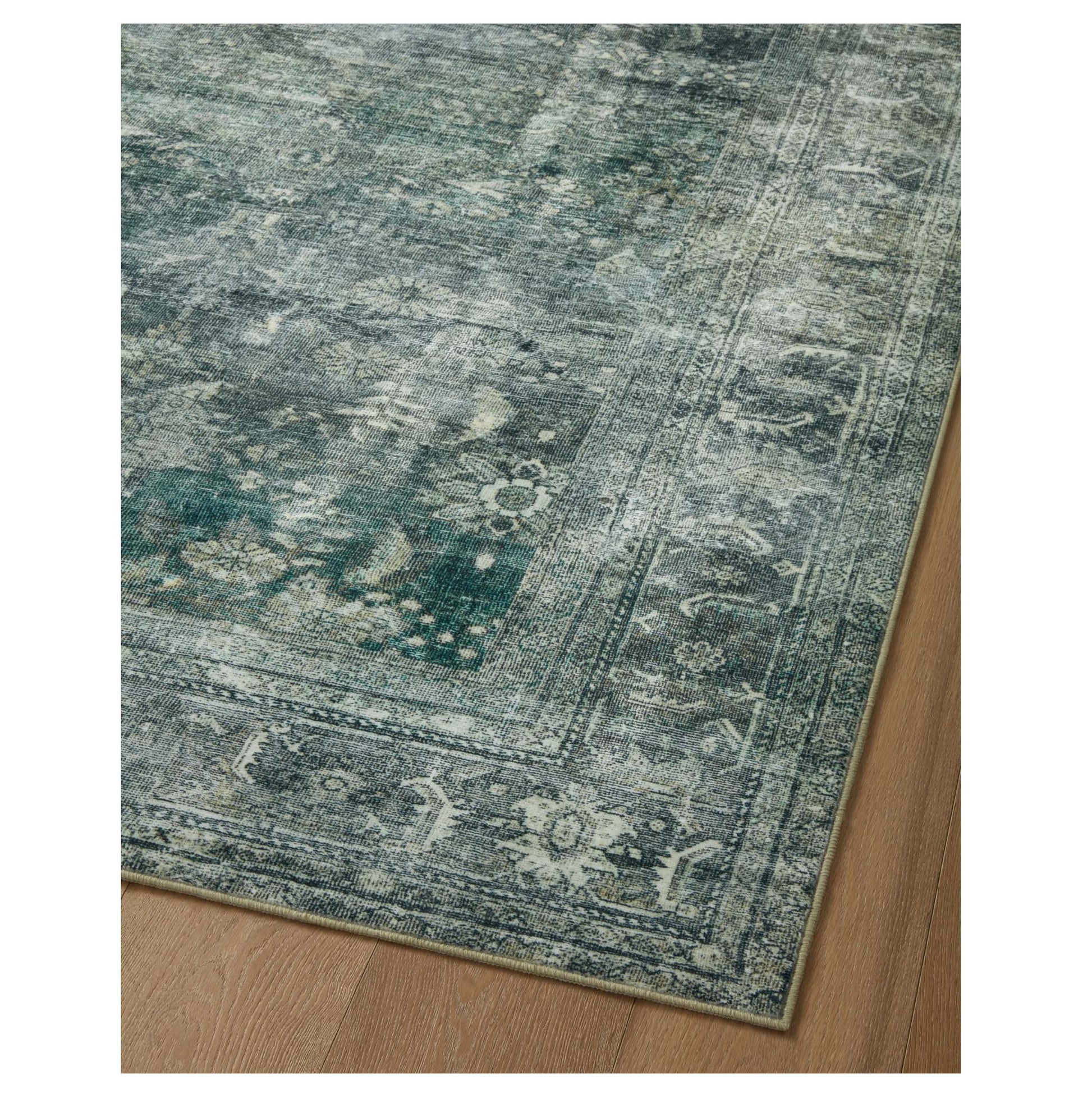 Banks Blue Lagoon Rug corner on wood floor