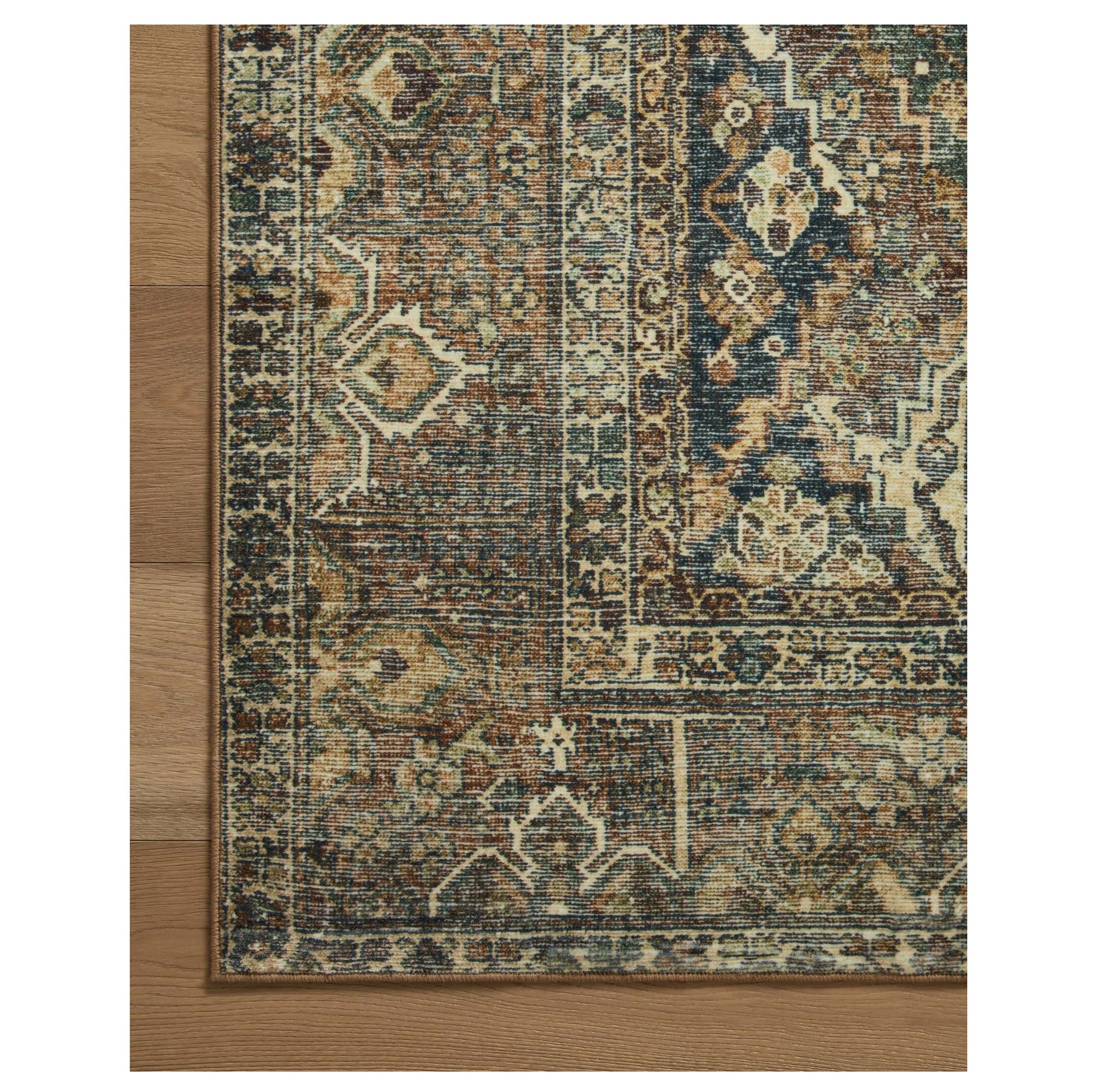 Banks Spice Blue Rug corner on wood floor