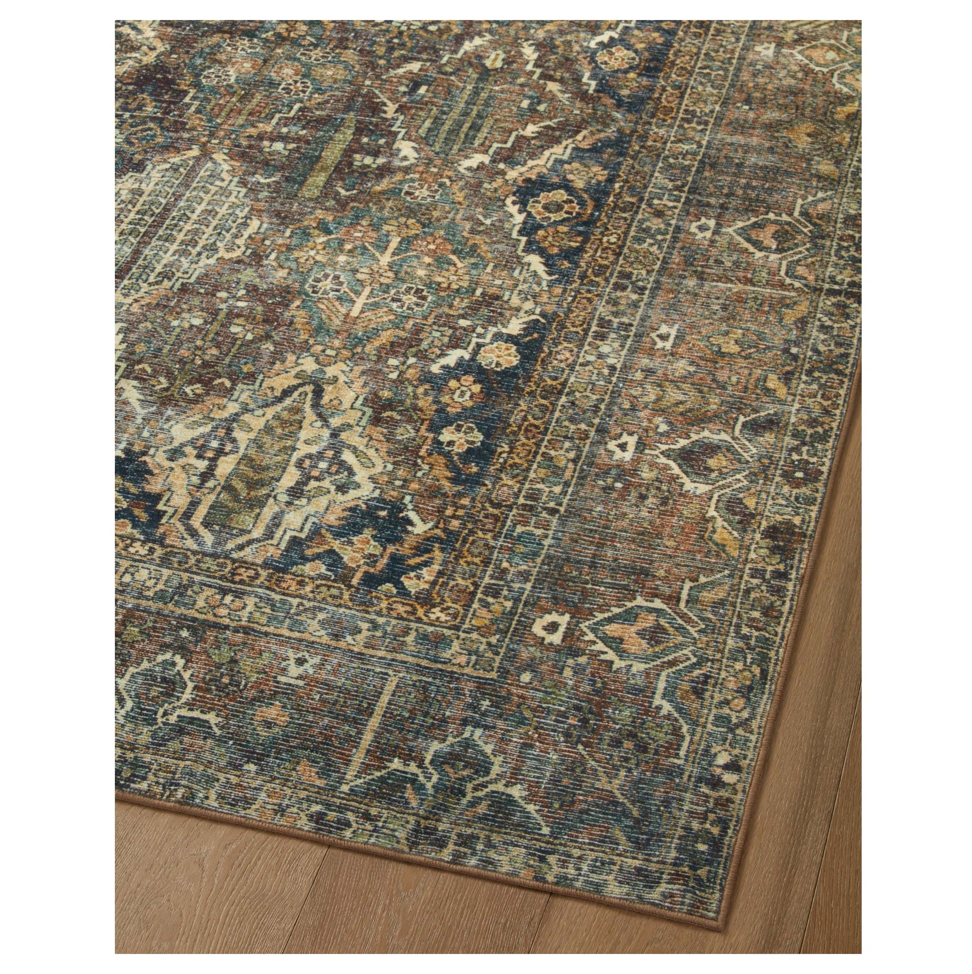 Banks Spice Blue Rug corner on wood floor