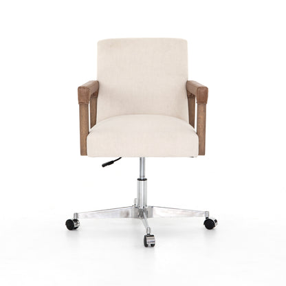 cream linen desk chair with leather-wrapped wooden arms and chrome metal base with wheels